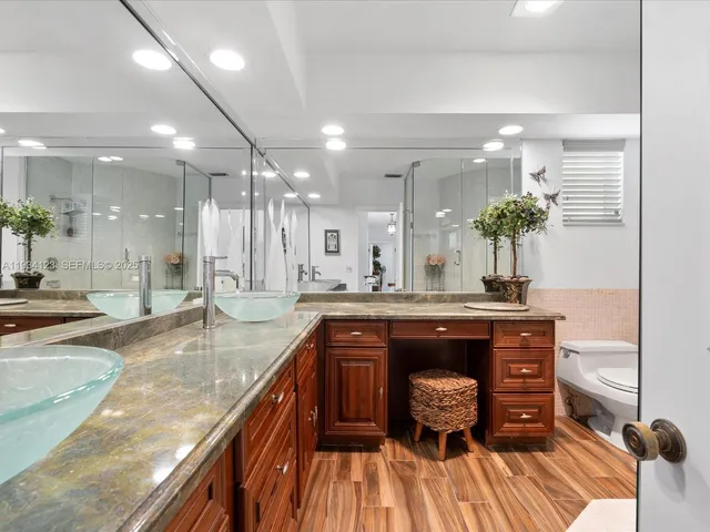 a view of kitchen with sink and wooden floor