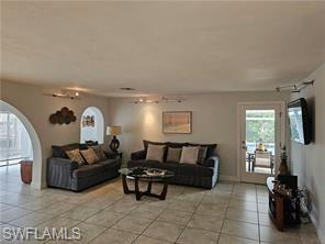 339 Landmark Street Marco Island, FL 34145 - Photo 17 of 18 a living room with furniture and a flat screen tv