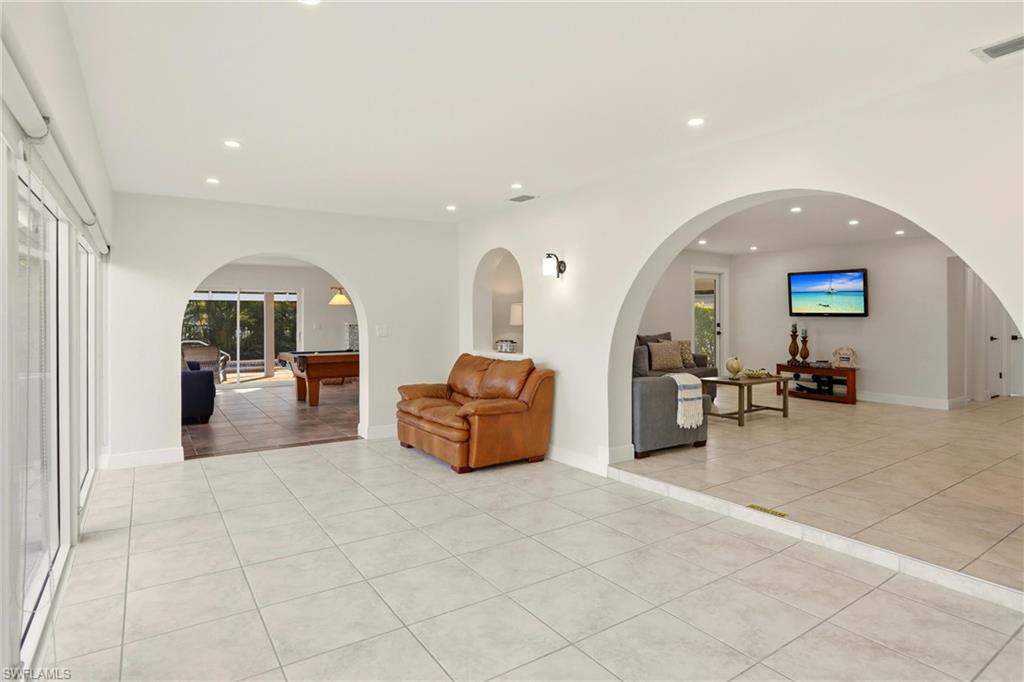 339 Landmark Street Marco Island, FL 34145 - Photo 27 of 49 a lobby with furniture and a mirror