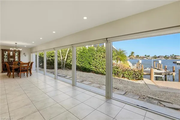 a view of a living room and a floor to ceiling window