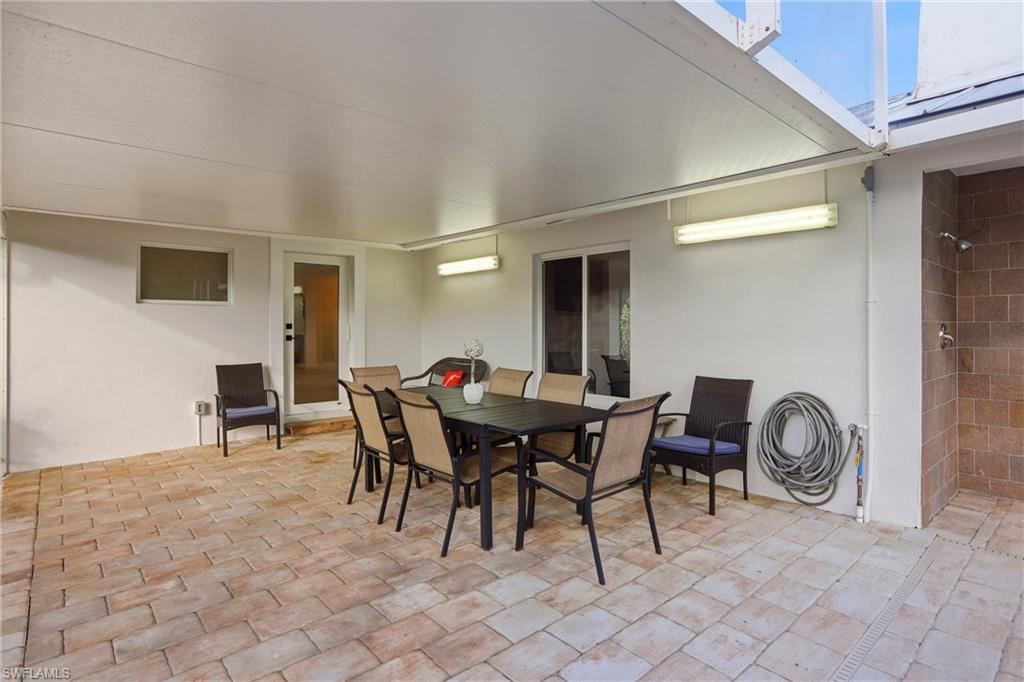339 Landmark Street Marco Island, FL 34145 - Photo 36 of 49 a view of a dining room with furniture and a rug