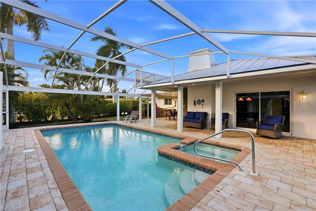 339 Landmark Street Marco Island, FL 34145 - Photo 39 of 49 a view of a dinning room with a patio
