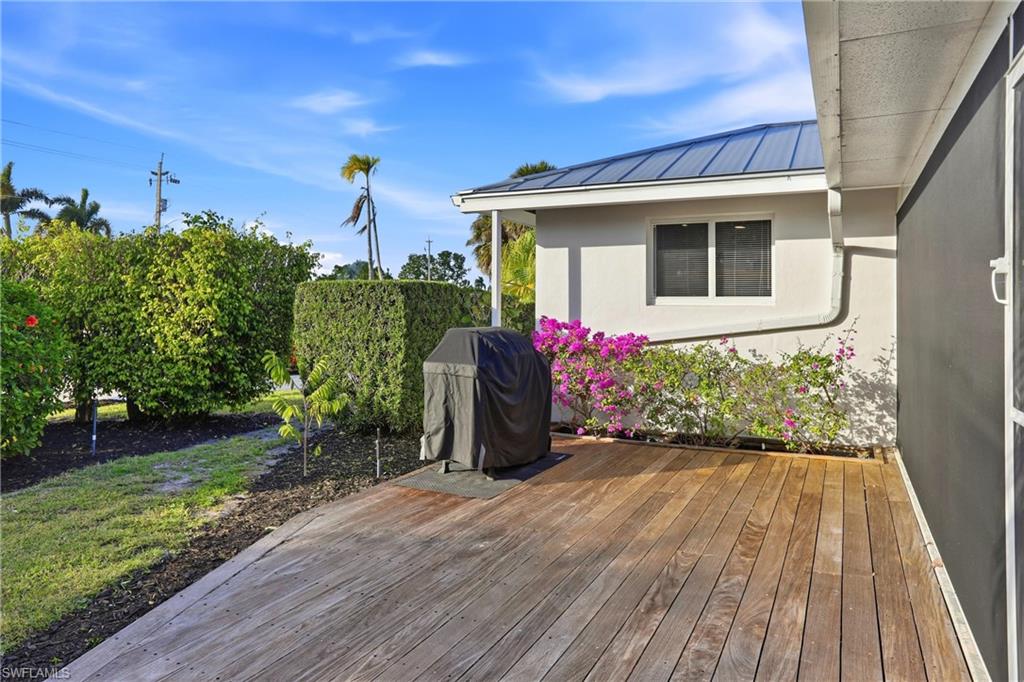 339 Landmark Street Marco Island, FL 34145 - Photo 42 of 49 a front view of a house with a yard