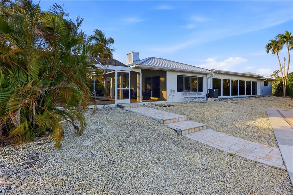 339 Landmark Street Marco Island, FL 34145 - Photo 43 of 49 a front view of a house with a yard