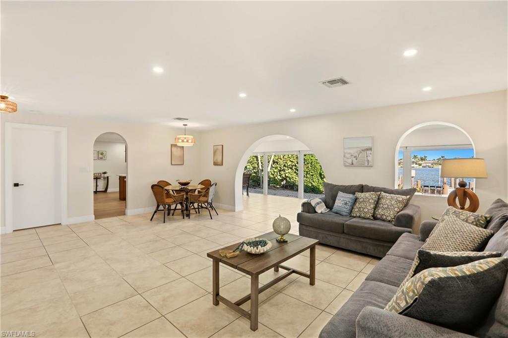 339 Landmark Street Marco Island, FL 34145 - Photo 5 of 49 a living room with furniture and a large window