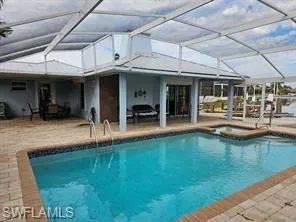 a view of a swimming pool with a patio
