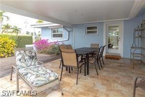 339 Landmark Street Marco Island, FL 34145 - Photo 6 of 18 a dining room with furniture and window