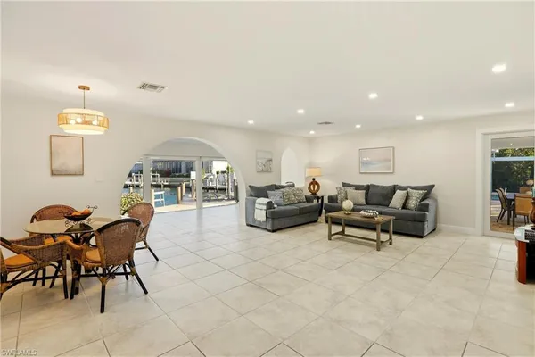a living room with furniture and a chair