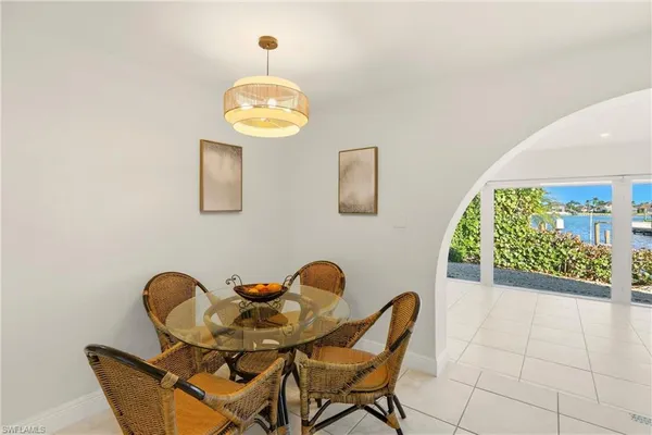a view of a dining room with furniture and a window