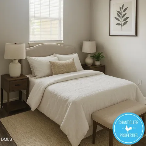 a bedroom with a bed and a painting on the wall