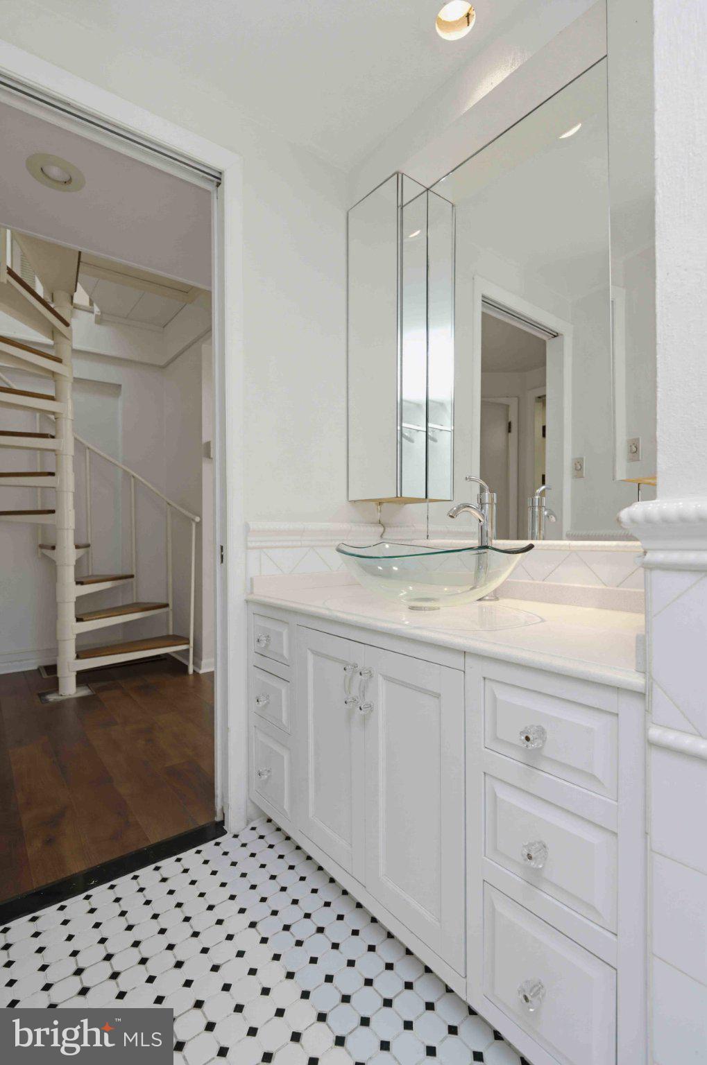 1268 Rydal Road Jenkintown, PA 19046 - Photo 25 of 31 a bathroom with a sink a vanity and a mirror