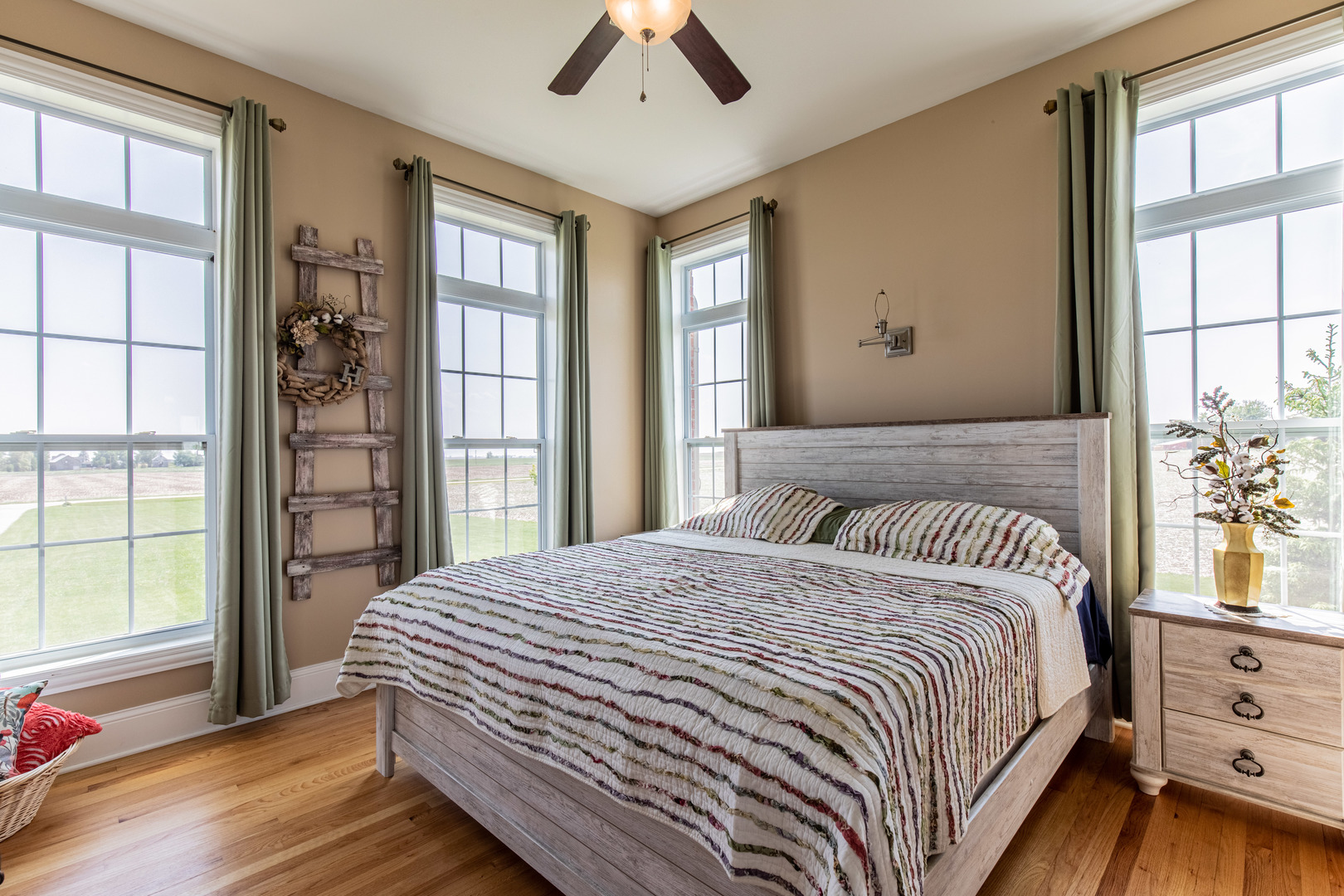 67 North 4750th Road Mendota, IL 61342 - Photo 11 of 31 a bedroom with a large bed and a chandelier