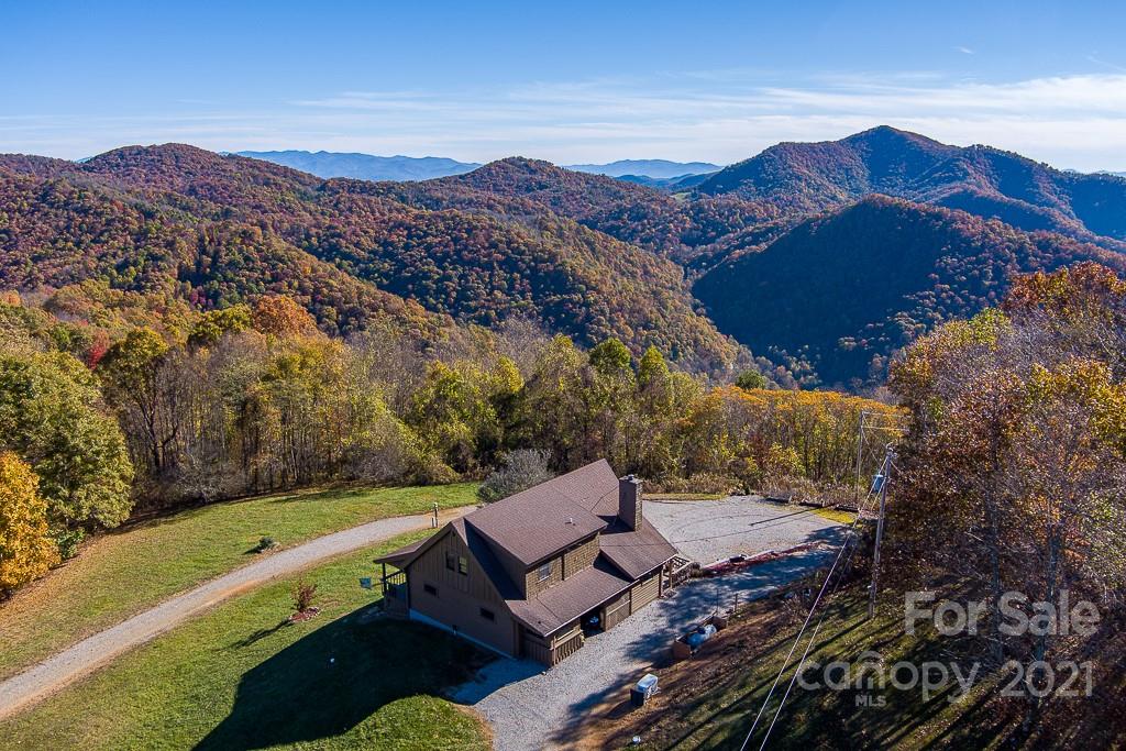 620 Pioneer Ridge Road Canton, NC 28716 - Photo 1 of 42 a view of a house with a mountain