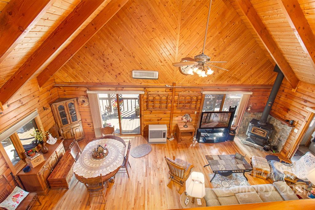 620 Pioneer Ridge Road Canton, NC 28716 - Photo 15 of 42 a dining room with furniture and a floor to ceiling window