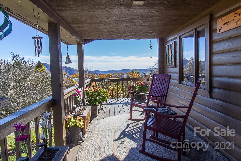 620 Pioneer Ridge Road Canton, NC 28716 - Photo 26 of 42 a view of a chairs and table in patio with potted plants