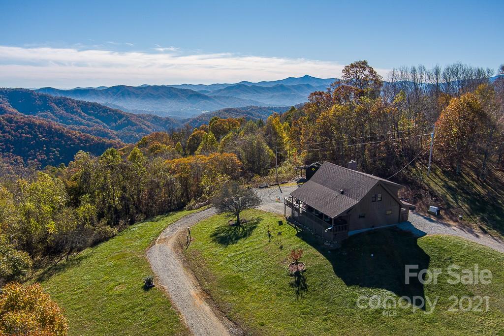 620 Pioneer Ridge Road Canton, NC 28716 - Photo 4 of 42 aerial view of a house with a yard