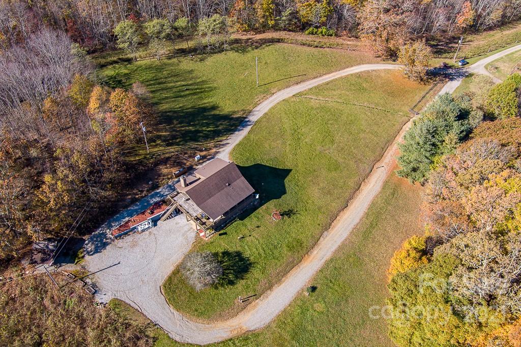 620 Pioneer Ridge Road Canton, NC 28716 - Photo 33 of 42 an aerial view of a house with a swimming pool