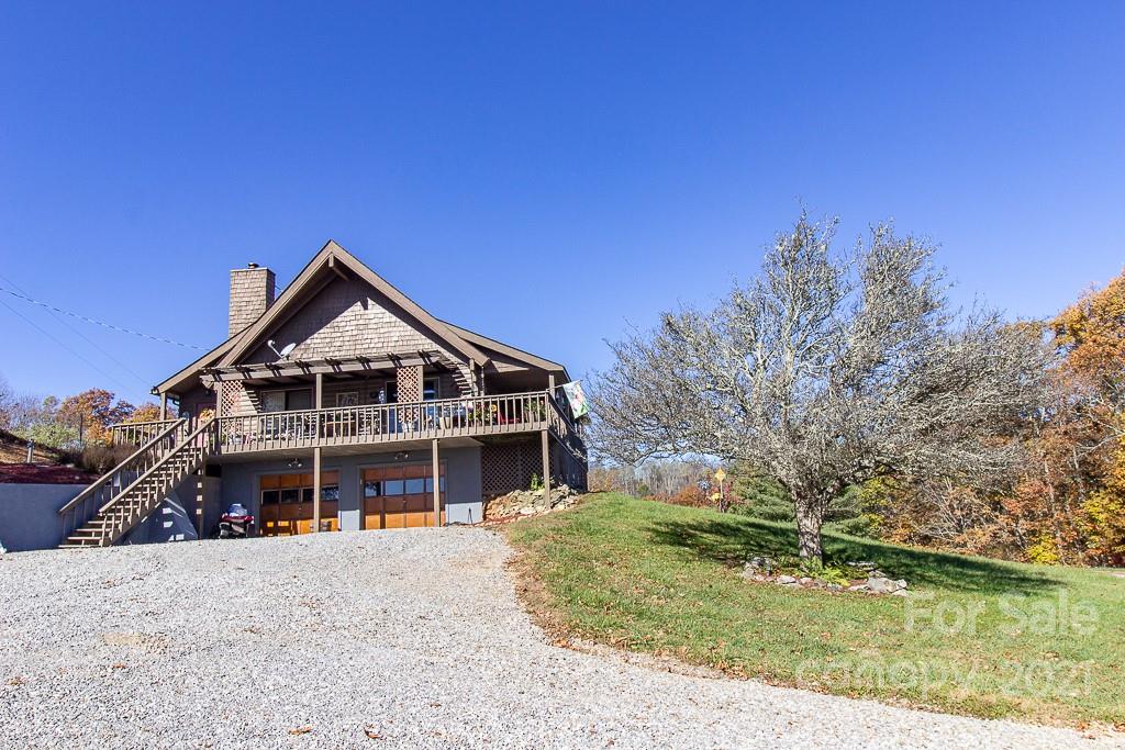 620 Pioneer Ridge Road Canton, NC 28716 - Photo 38 of 42 a front view of a house with a yard