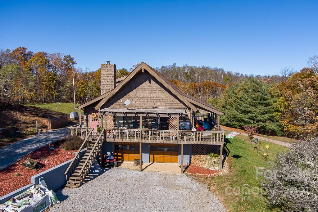 620 Pioneer Ridge Road Canton, NC 28716 - Photo 39 of 42 an aerial view of a house with a big yard
