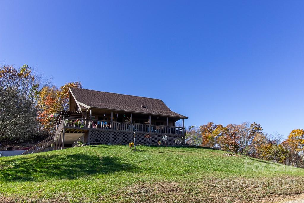 620 Pioneer Ridge Road Canton, NC 28716 - Photo 40 of 42 a front view of a house with a garden