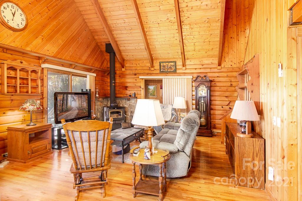 620 Pioneer Ridge Road Canton, NC 28716 - Photo 6 of 42 a view of a dining room with furniture and wooden floor
