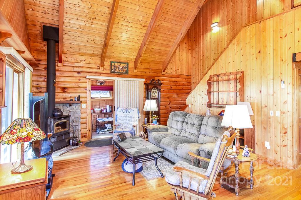 620 Pioneer Ridge Road Canton, NC 28716 - Photo 7 of 42 a living room with fireplace furniture and a window