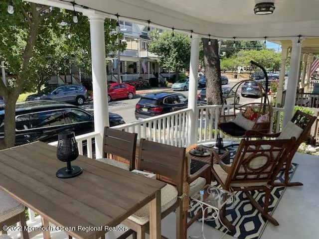 a view of a chairs and table in patio