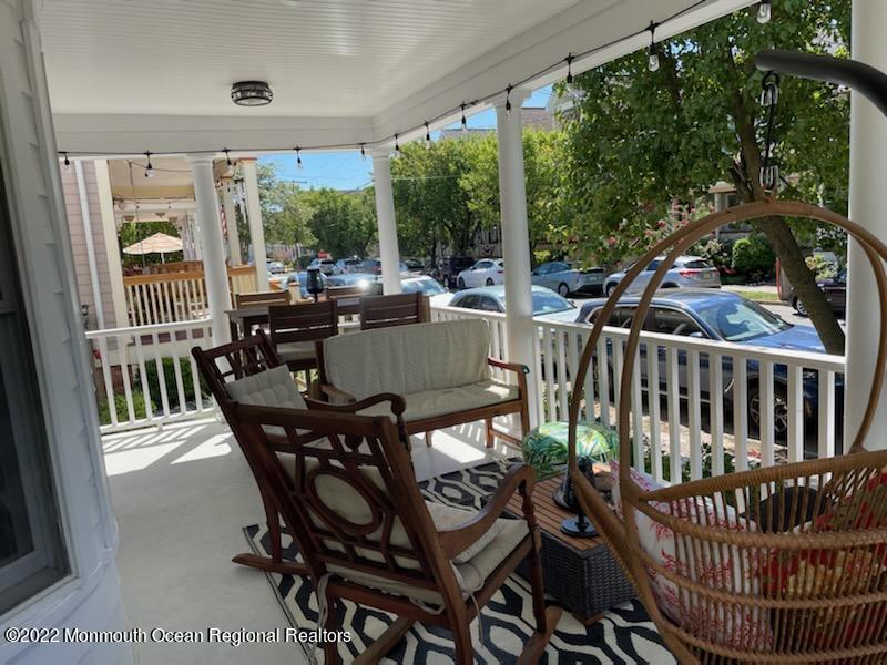 73 Cookman Avenue, Unit A Ocean Grove, NJ 07756 - Photo 5 of 20 a view of a patio with a table and chairs