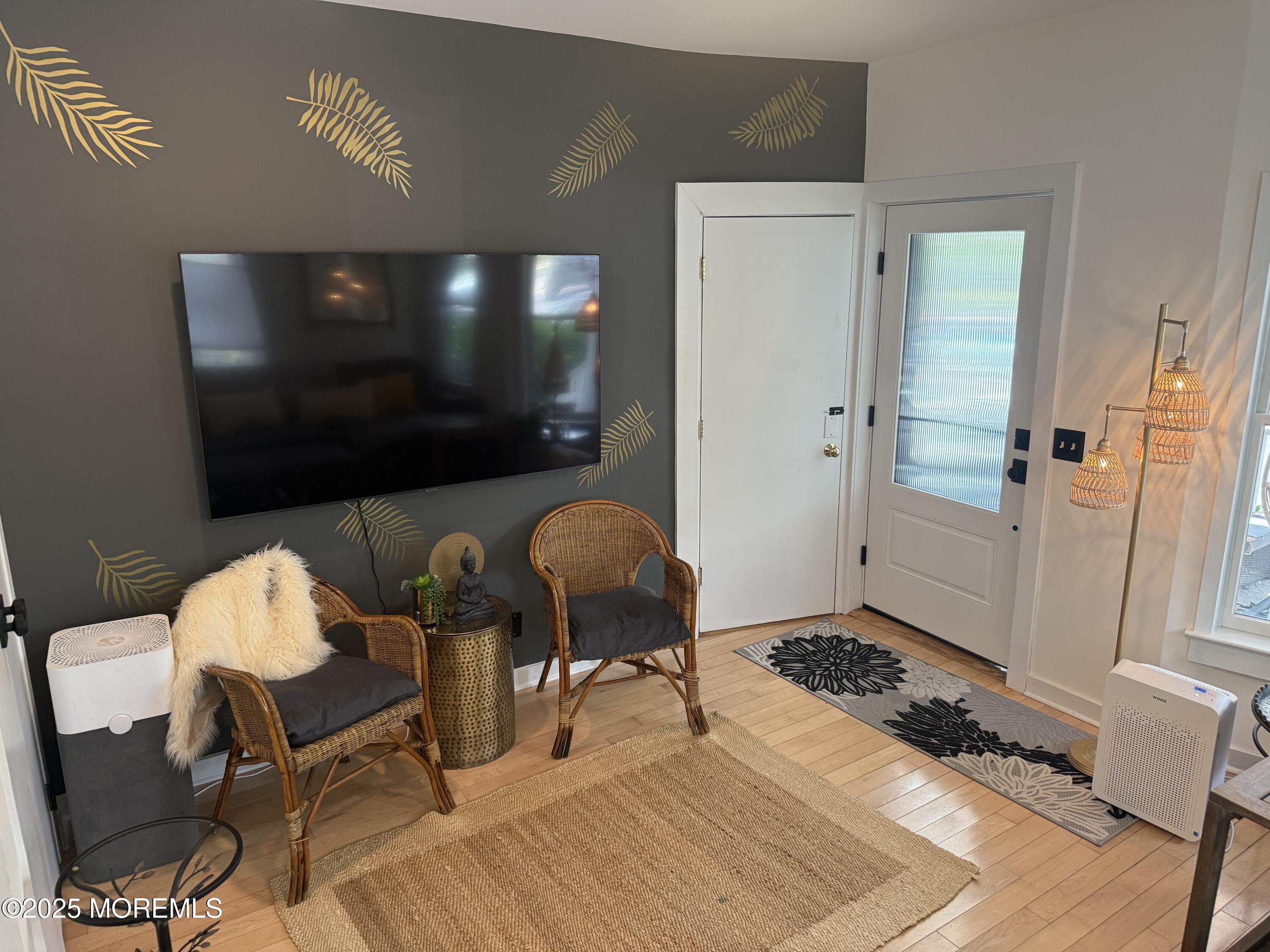 73 Cookman Avenue, Unit A Ocean Grove, NJ 07756 - Photo 8 of 20 a living room with furniture and a flat screen tv