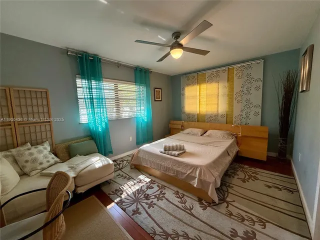 a bed room with a bed furniture and a window