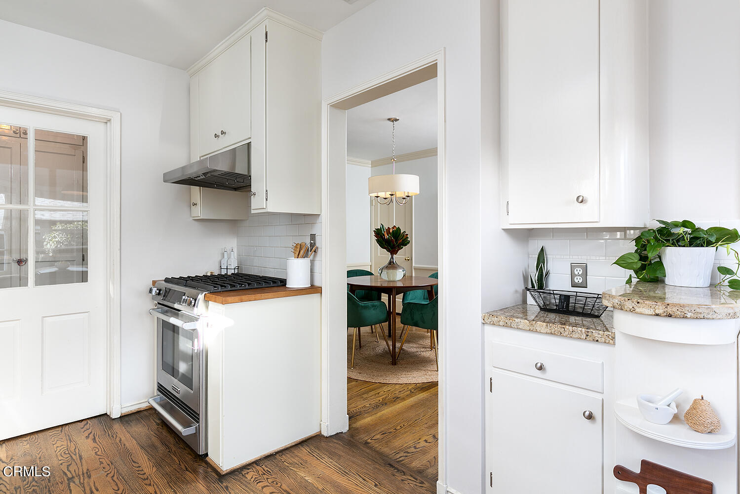 420 Northcliff Road Pasadena, CA 91107 - Photo 13 of 25 a kitchen with stainless steel appliances granite countertop a stove and a white cabinets