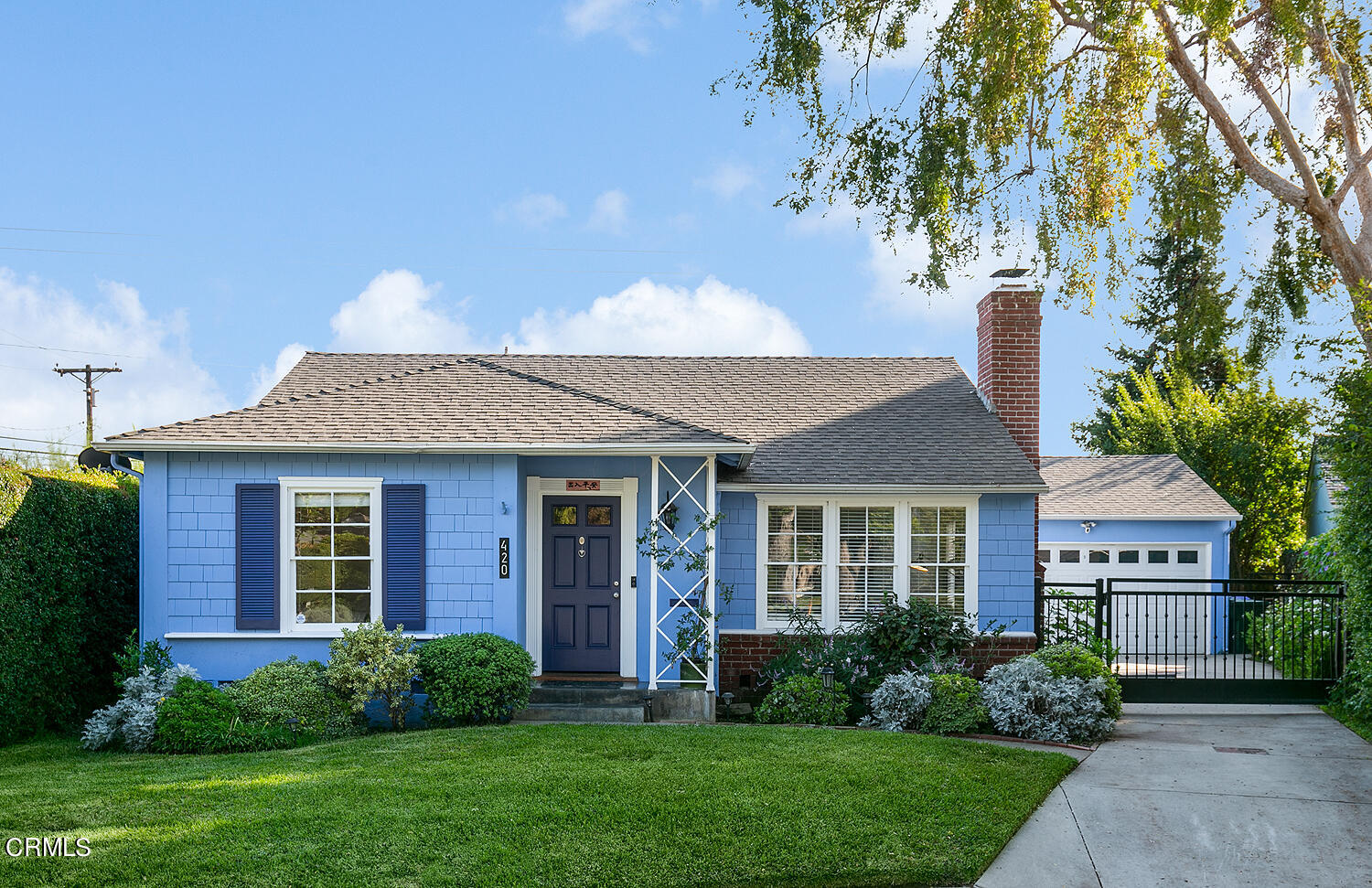 420 Northcliff Road Pasadena, CA 91107 - Photo 2 of 25 a front view of a house with a yard and trees