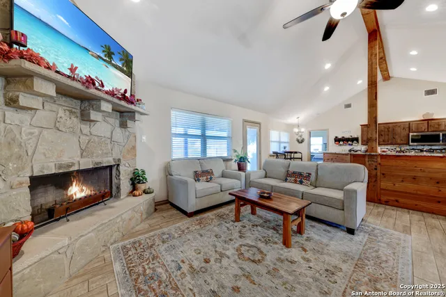 a living room with furniture and a fireplace