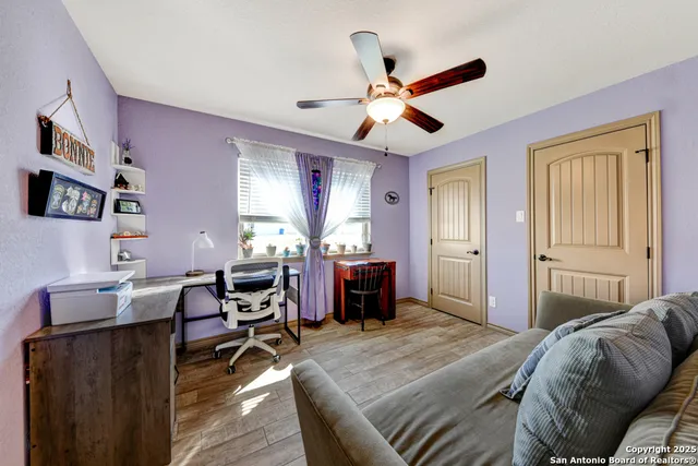 a bedroom with furniture and a window