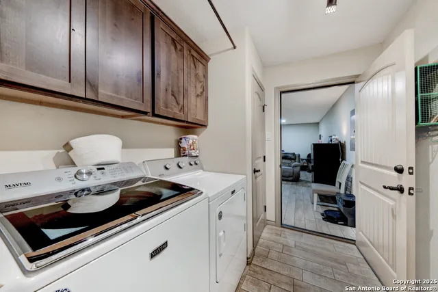 a kitchen with a sink cabinets and utility
