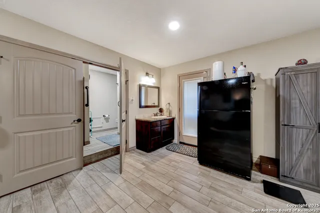 a kitchen with a refrigerator and a sink