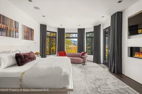 a en suite bathroom with a couch and a window