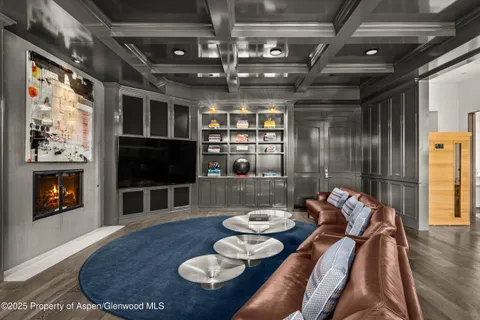 a living room with lots of furniture and a rug