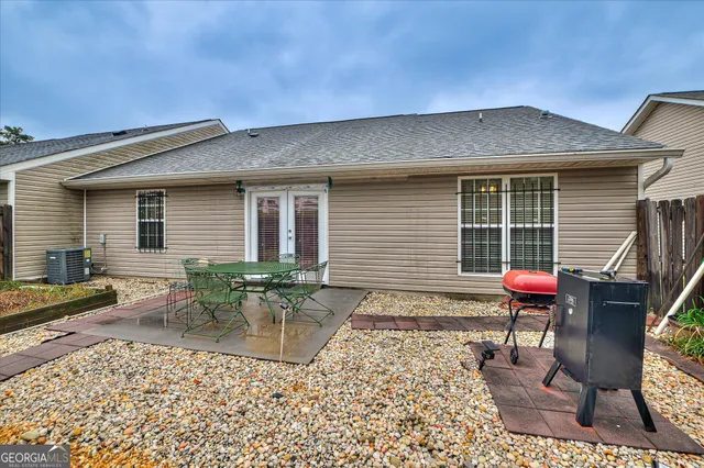 a front view of house with outdoor seating
