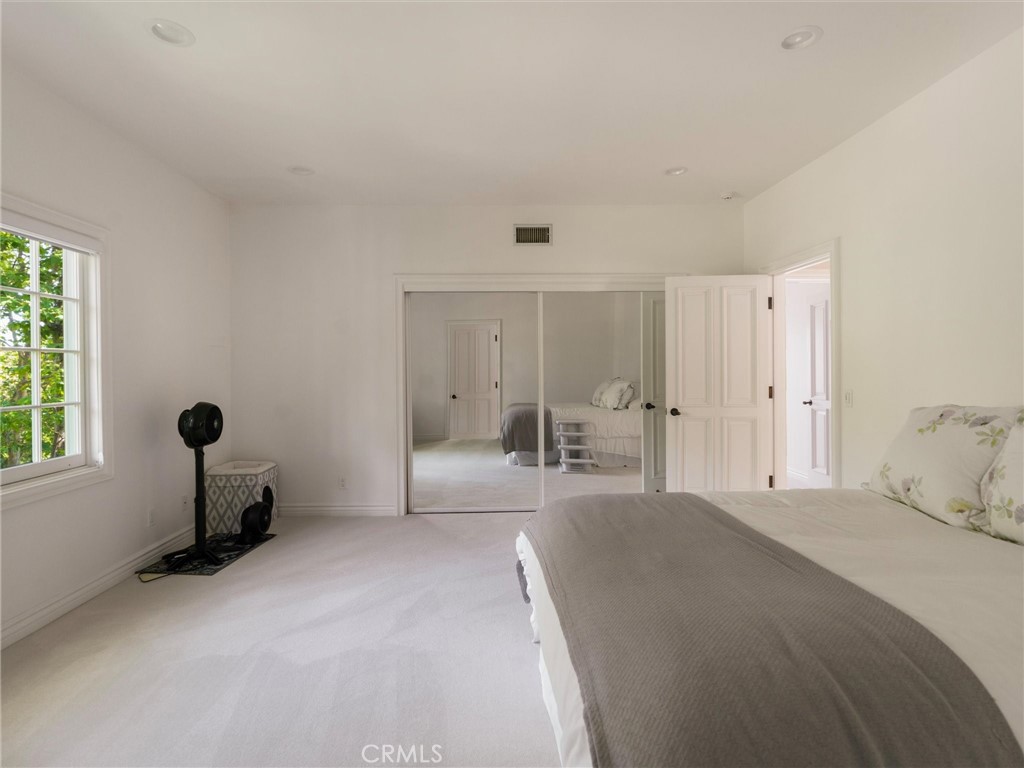 6000 Cavalleri Road Malibu, CA 90265 - Photo 38 of 44 a bedroom with a bed and a window