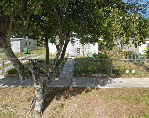 2341 Rutland Street Opa-Locka, FL 33054 - Photo 1 of 1 a view of a yard with plants and trees