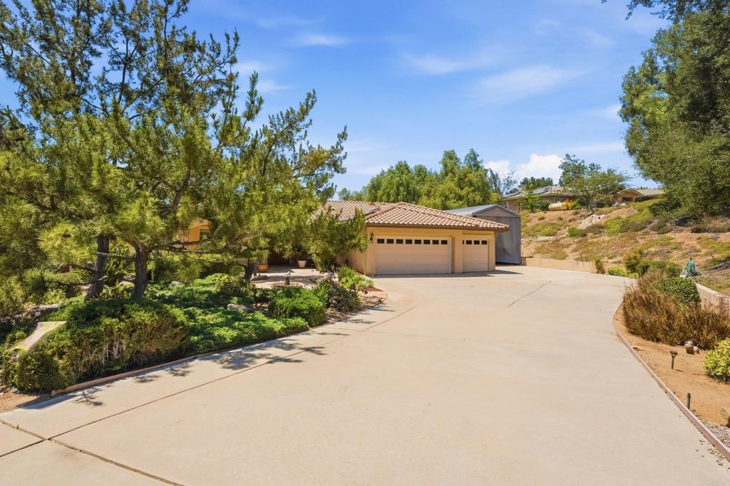 2527 Southern Oak Road Ramona, CA 92065 - Photo 11 of 56 a sign board with a car park in the back