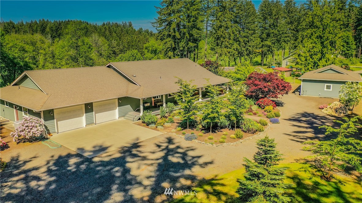 5124 133rd Avenue Southwest Rochester, WA 98579 - Photo 2 of 36 a view of a house with a yard and sitting area