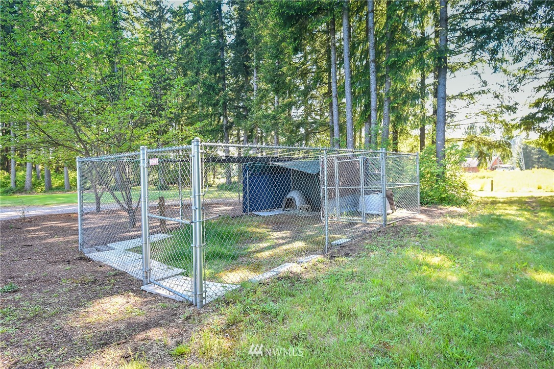 5124 133rd Avenue Southwest Rochester, WA 98579 - Photo 15 of 36 a view of a house with backyard and a tree