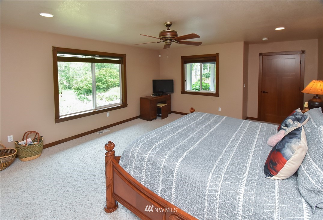 5124 133rd Avenue Southwest Rochester, WA 98579 - Photo 21 of 36 a bedroom with a bed and a window