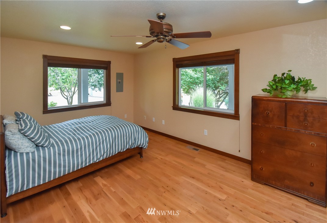 5124 133rd Avenue Southwest Rochester, WA 98579 - Photo 25 of 36 a view of a livingroom with a window and wooden floor