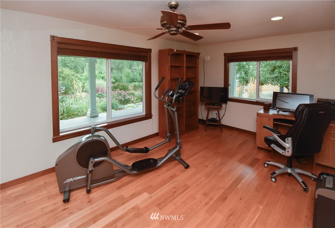5124 133rd Avenue Southwest Rochester, WA 98579 - Photo 26 of 36 a view of a workspace with furniture and a window