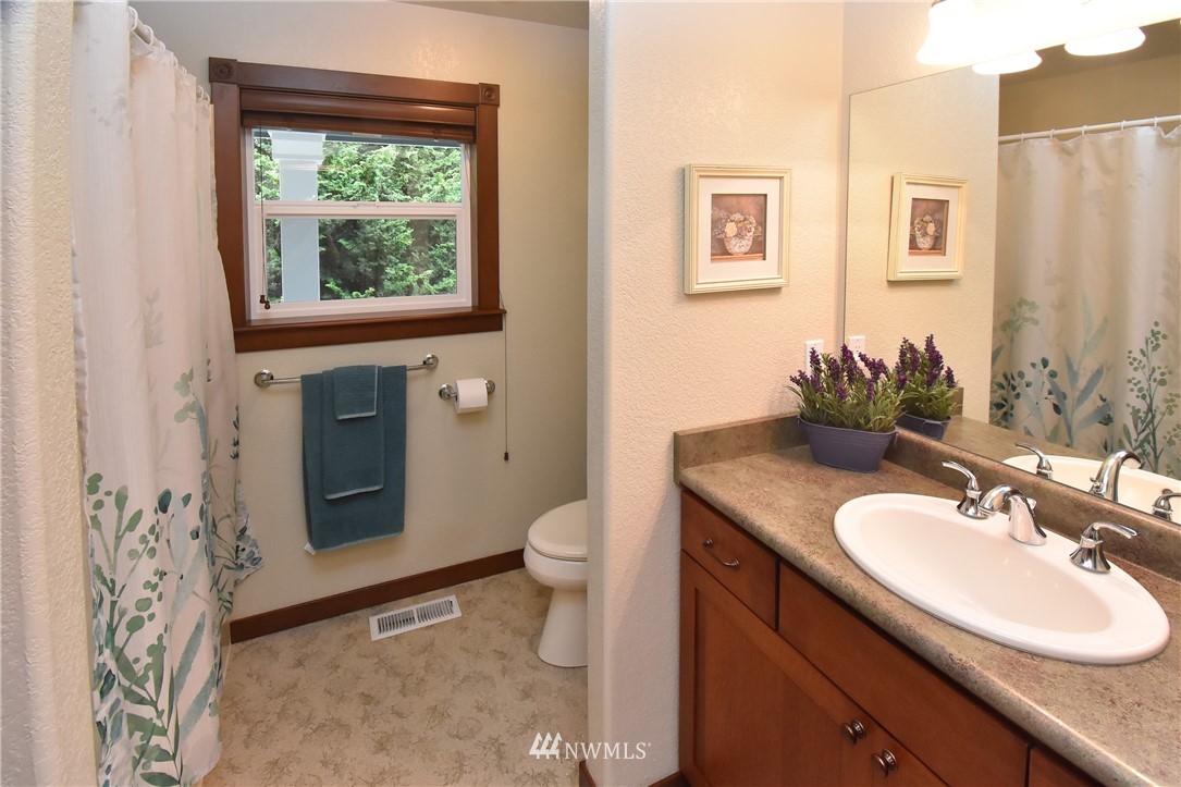 5124 133rd Avenue Southwest Rochester, WA 98579 - Photo 27 of 36 a bathroom with a sink toilet and window