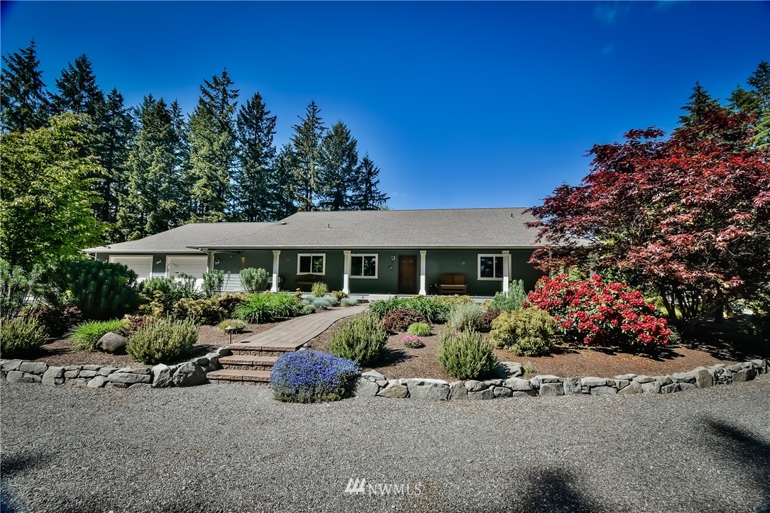 5124 133rd Avenue Southwest Rochester, WA 98579 - Photo 4 of 36 front view of a house with a yard