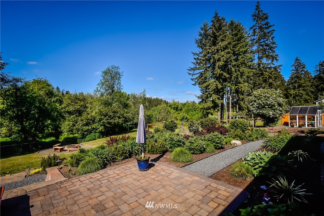 5124 133rd Avenue Southwest Rochester, WA 98579 - Photo 33 of 36 a view of a garden with potted plants